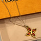 Pointed Flower / Amber Orange Crystal Logo 2- Sided Louis Vuitton Charm on Necklace